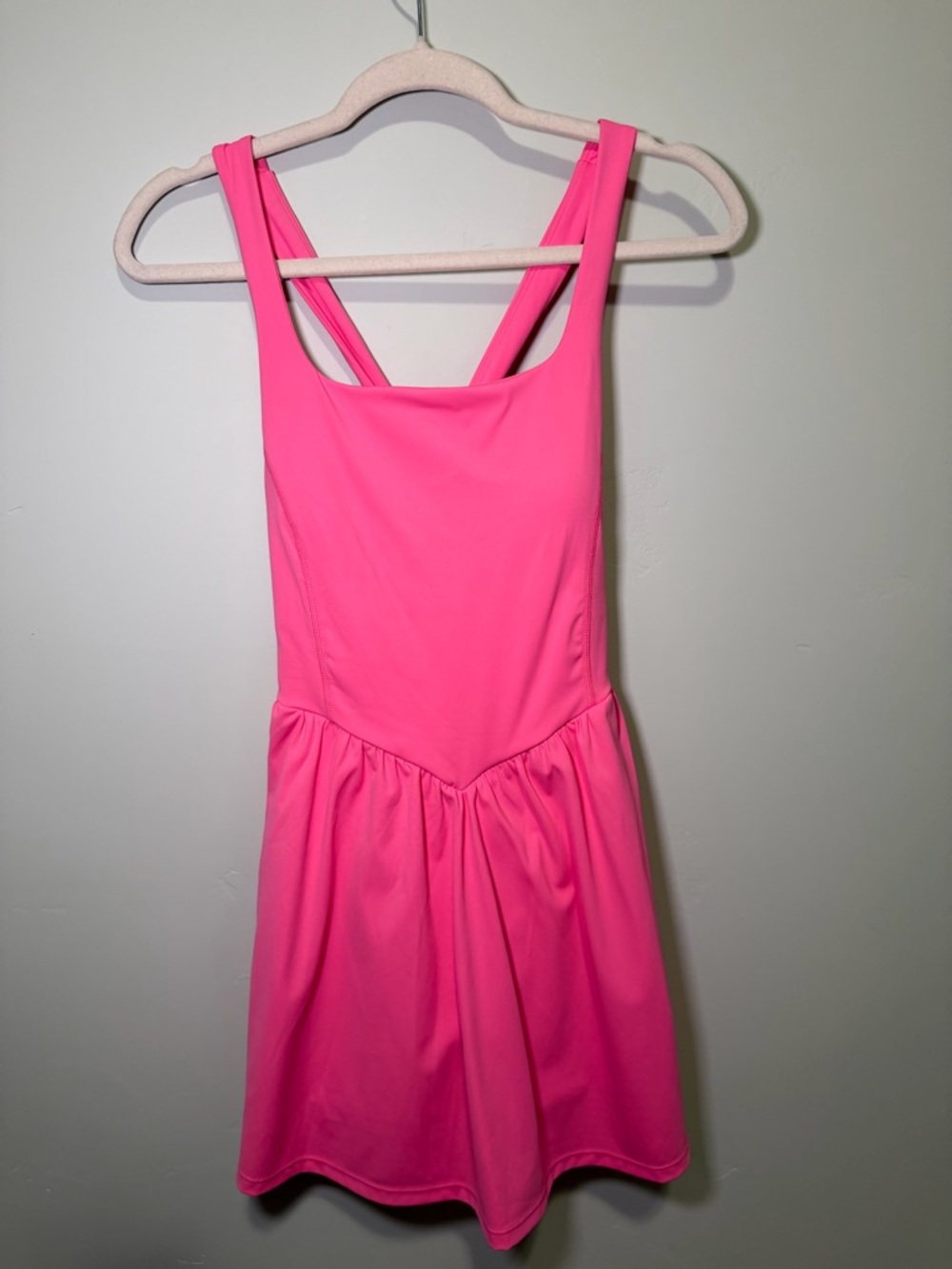Pink athletic dress.